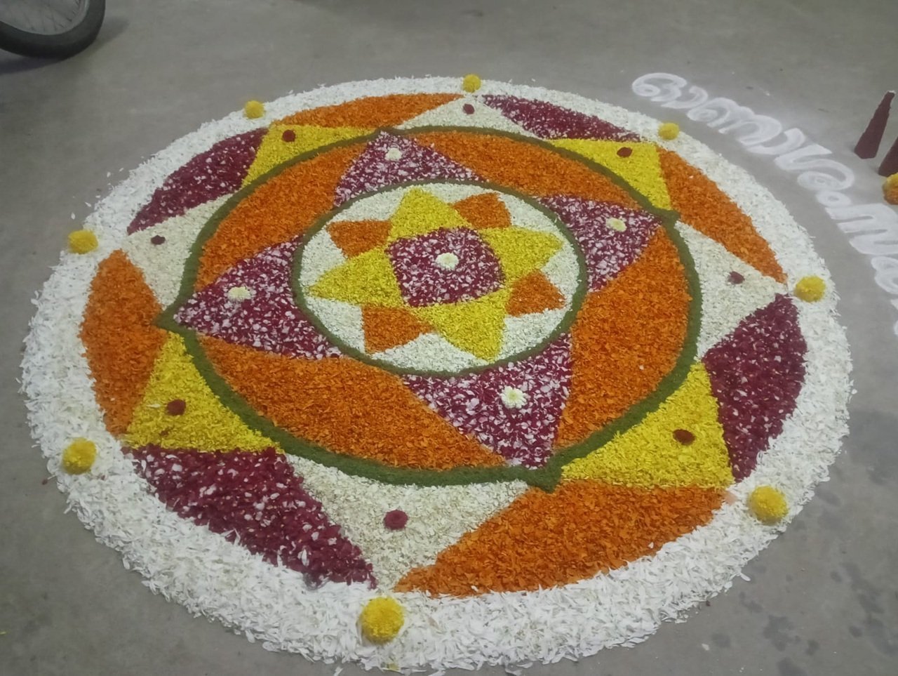 Pookalam floral rangoli created by Ashiana Hostel residents for Onam 2026